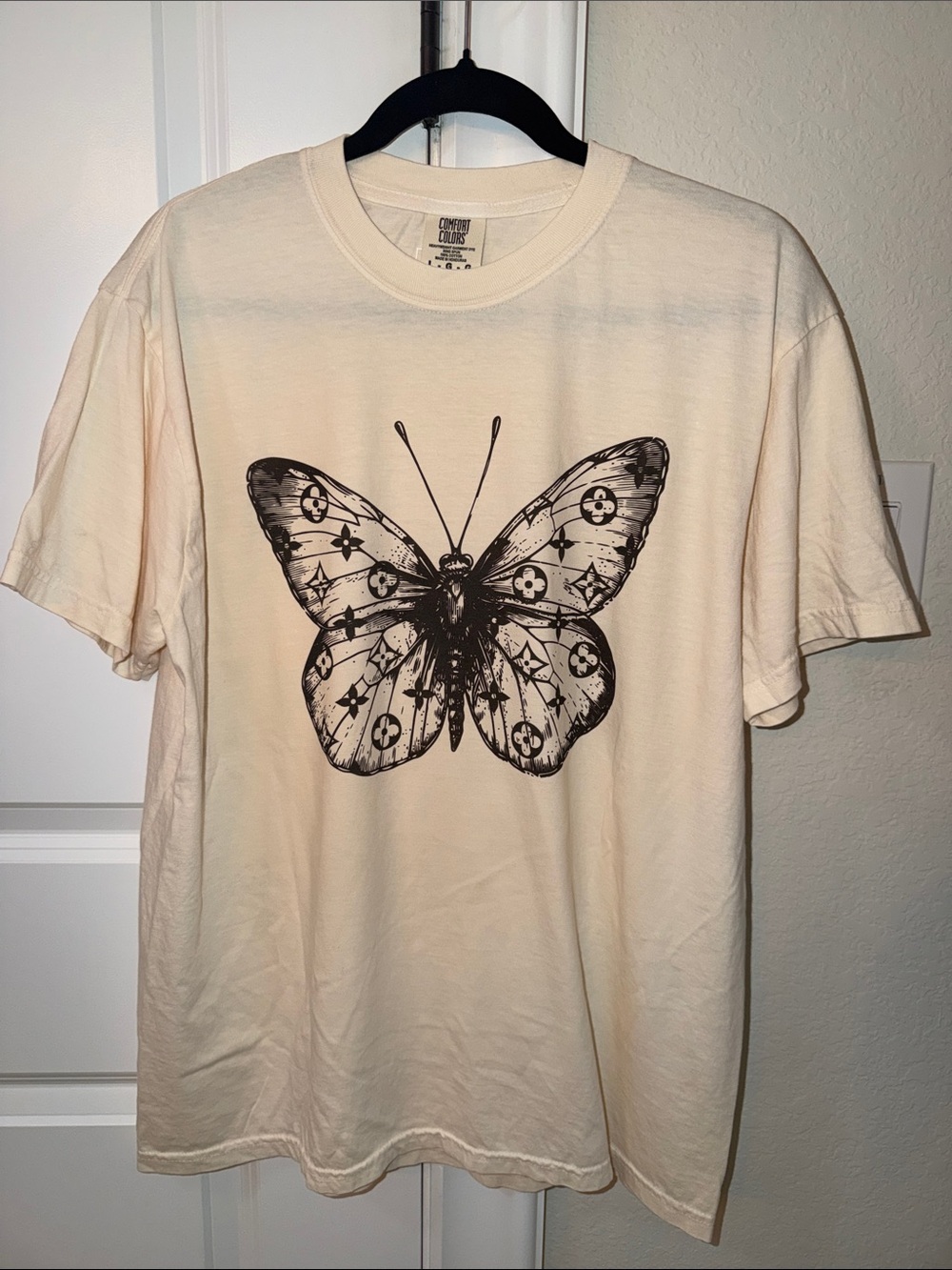 Comfort Colors in Ivory, Black Butterfly with Iconic Monogram Graphic | Sz L